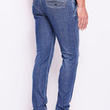 Jeans chino slim con lavaggio usato
