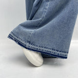 Jeans vita alta e gamba larga