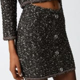 Minigonna in maglia bouclè con paillettes