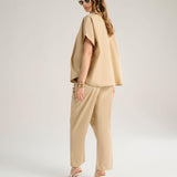 Pantalone con pieghe
