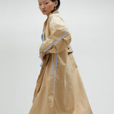 Trench beige con bordini