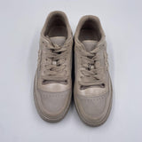 Sneakers in pelle con logo a contrasto