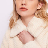 Cappotto in pelliccia con cintura
